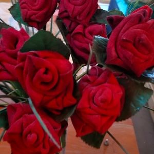HAND made. One dozen red leather roses. Nice